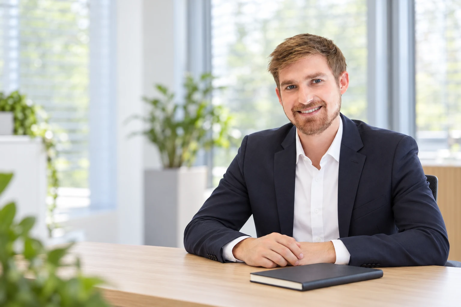 Stefan Hauenstein seated at an office desk